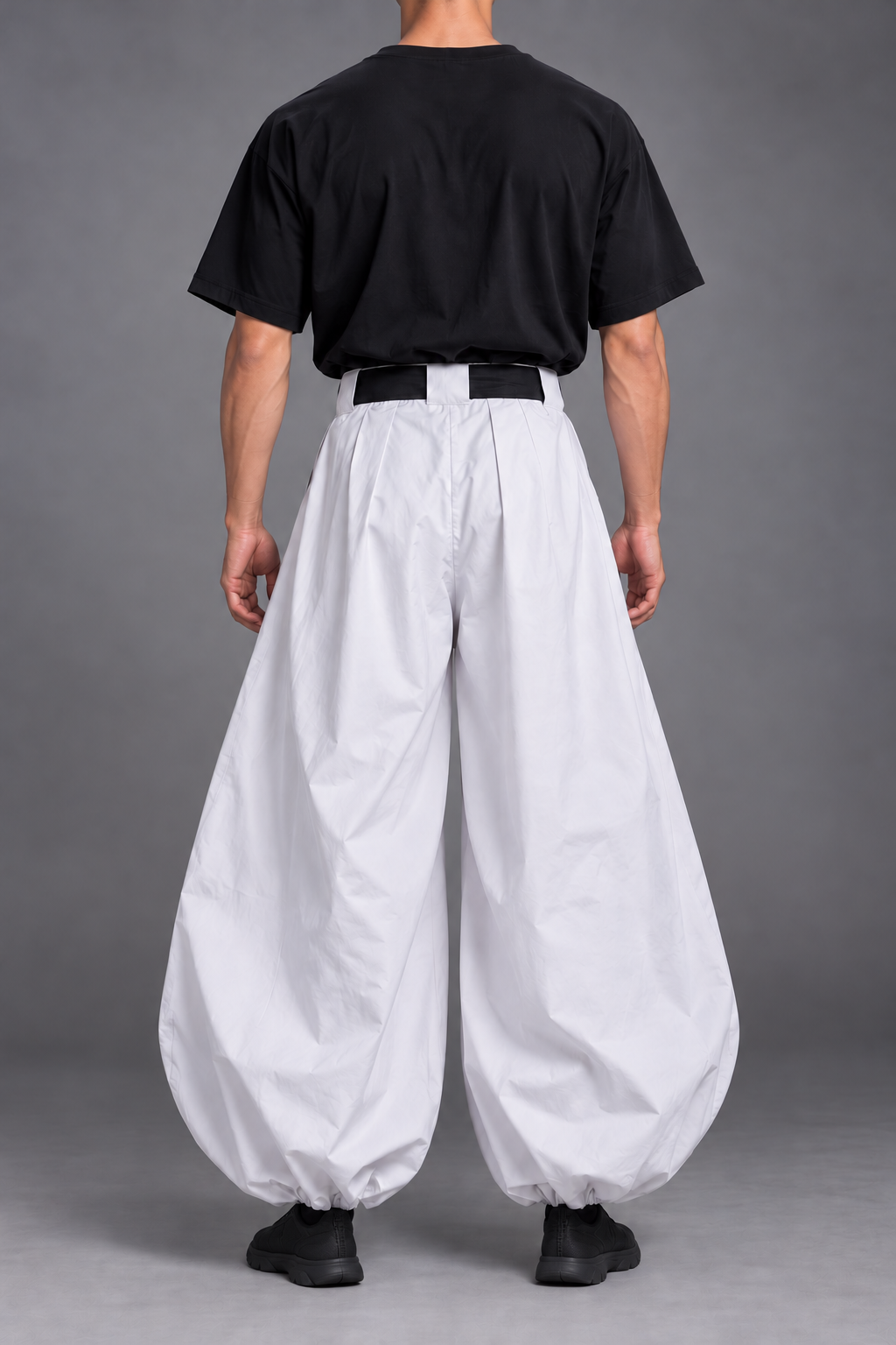 Toji costume back view – black T-shirt, sash and white trousers